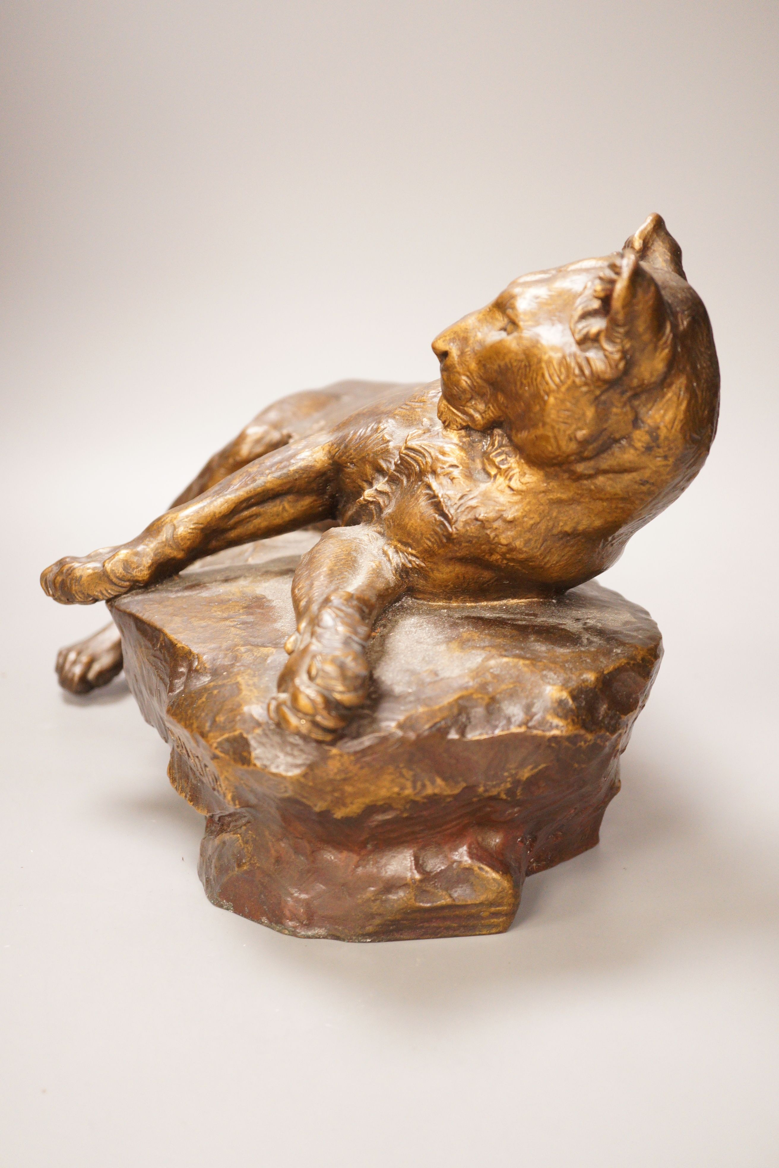 After Charles Valton, a gilt bronze study of a recumbent lioness, 39cm